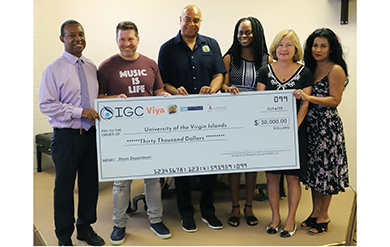 Vice President of Institutional Advancement Mitchell Neaves, Paul Talbert, Dion Parson, Dr. Kimarie Engerman, Marjorie Rawls Robert P.C. and Cindy Talbert pose at a check presentation held in the Music Building on the St. Thomas Campus 